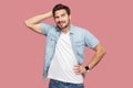 Portrait of query handsome bearded young man in blue casual style shirt standing and looking away and thinking what to do Royalty Free Stock Photo