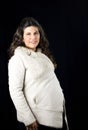 Portrait of radiantly pregnant woman in winter clothes Royalty Free Stock Photo