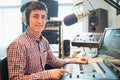 Portrait of radio host using sound mixer Royalty Free Stock Photo