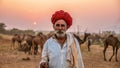 Portrait of a Rajasthani camel trader at sunset, in India.