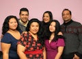 Portrait of a real Mexican Latino family with diverse bodies with father, mother, sons and brothers very happy posing to the camer