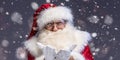 Portrait of real Santa Claus with long beard, looking at the camera, posing over falling snow. Christmas is coming!  Xmas time Royalty Free Stock Photo