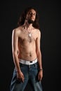 Portrait of rebel with long hair and topless slim Royalty Free Stock Photo