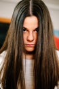 Portrait of rebellious teen girl with long brown hair Royalty Free Stock Photo