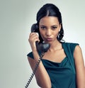 Portrait, receptionist and business woman on telephone with person pouting in studio isolated on a gray background Royalty Free Stock Photo