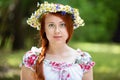 Portrait of a red-haired freckled woman