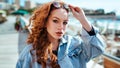 portrait of a red-haired girl in sunglasses Royalty Free Stock Photo