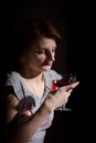Portrait of red-haired woman with a glass of red wine Royalty Free Stock Photo