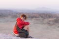 Portrait of a red haired woman with green eyes, eyeglasses and smiling facial expression. Sunset at the horizon. Shot outdoors wit Royalty Free Stock Photo