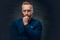 Redhead bearded hipster male dressed in a blue jacket. Royalty Free Stock Photo