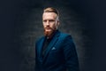 Redhead bearded hipster male dressed in a blue jacket. Royalty Free Stock Photo