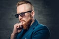 Redhead bearded hipster male dressed in a blue jacket. Royalty Free Stock Photo