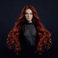 Portrait of redhead woman with long hair on black backgroun Royalty Free Stock Photo