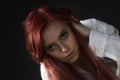 Portrait of redhead young woman in trouble looking at the camera Royalty Free Stock Photo