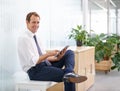 Portrait, relax and man in office with tablet, sales review or profit report at online consulting agency. Internet Royalty Free Stock Photo