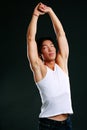 Portrait of relaxed asian man stretching
