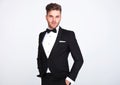 Portrait of relaxed elegant man in black tuxedo