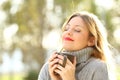 Relaxed girl breathing outdoors in winter Royalty Free Stock Photo