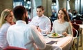 Portrait of relaxed and happy smiling adults having dinner