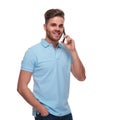 Portrait of relaxed man in polo shirt speaking on phone