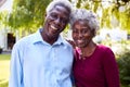 Portrait Of Relaxed Senior Couple Standing In Garden At Home After Retirement Royalty Free Stock Photo