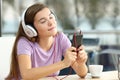 Relaxed teen listening to music in a bar