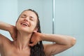 Portrait of relaxed woman taking shower Royalty Free Stock Photo