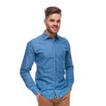 Portrait of relaxed young casual man standing and smiling Royalty Free Stock Photo