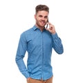 Portrait of relaxed young casual man talking on the phone Royalty Free Stock Photo