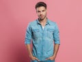 Portrait of relaxed young man wearing a denim shirt