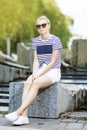 Portrait of Relaxing Caucasian Teenage Girl Posing in Green Summer Park Royalty Free Stock Photo