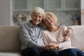 Portrait of retired couple pose for camera at modern home Royalty Free Stock Photo