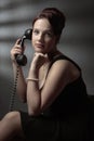 Portrait in retro style with old black phone Royalty Free Stock Photo