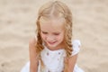 Portrait risible blonde girl with pigtails and blue round eyes