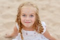 Portrait risible blonde girl with pigtails and blue round eyes Royalty Free Stock Photo