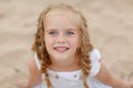 Portrait risible blonde girl with pigtails and blue round eyes Royalty Free Stock Photo