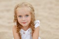 Portrait risible blonde girl with pigtails and blue round eyes