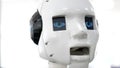 Portrait of a robots head. White modern robot at the exhibition of new technologies. Modern Robotic Technologies.