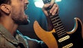 Portrait of a rock star playing a guitar Royalty Free Stock Photo