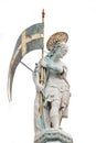 Portrait of Roman warrior old sculpture as a saint at the dome roof of Basilica San Marco in Venice, Italy, isolated at white