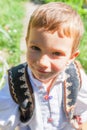 Portrait Of Romanian Peasant Child Feeling Amused