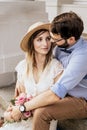Portrait of romantic couple look at each other on building background Royalty Free Stock Photo
