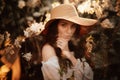 Portrait of a romantic girl in a blooming garden with elements of phantasmagoria. Royalty Free Stock Photo