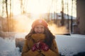 Portrait of romantic girl at sunset, sunrise, gold per hour on a frosty winter day