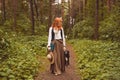 Portrait of romantic hippie woman smile in the woods.