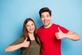 Portrait of romantic two spouses promoters show thumb up sign decide ads choose promo advice sales wear green red t
