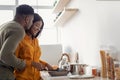 Portrait Of Romantic Young African American Couple Cooking Together In Kitchen Royalty Free Stock Photo