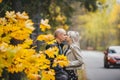 Portrait of romantic young couple in autumn landscape near road