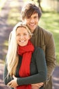 Portrait Of Romantic Young Couple In Autumn Park Royalty Free Stock Photo