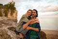 Portrait Of Romantic Young Couple Embracing On The Beach At Sunset Time Royalty Free Stock Photo